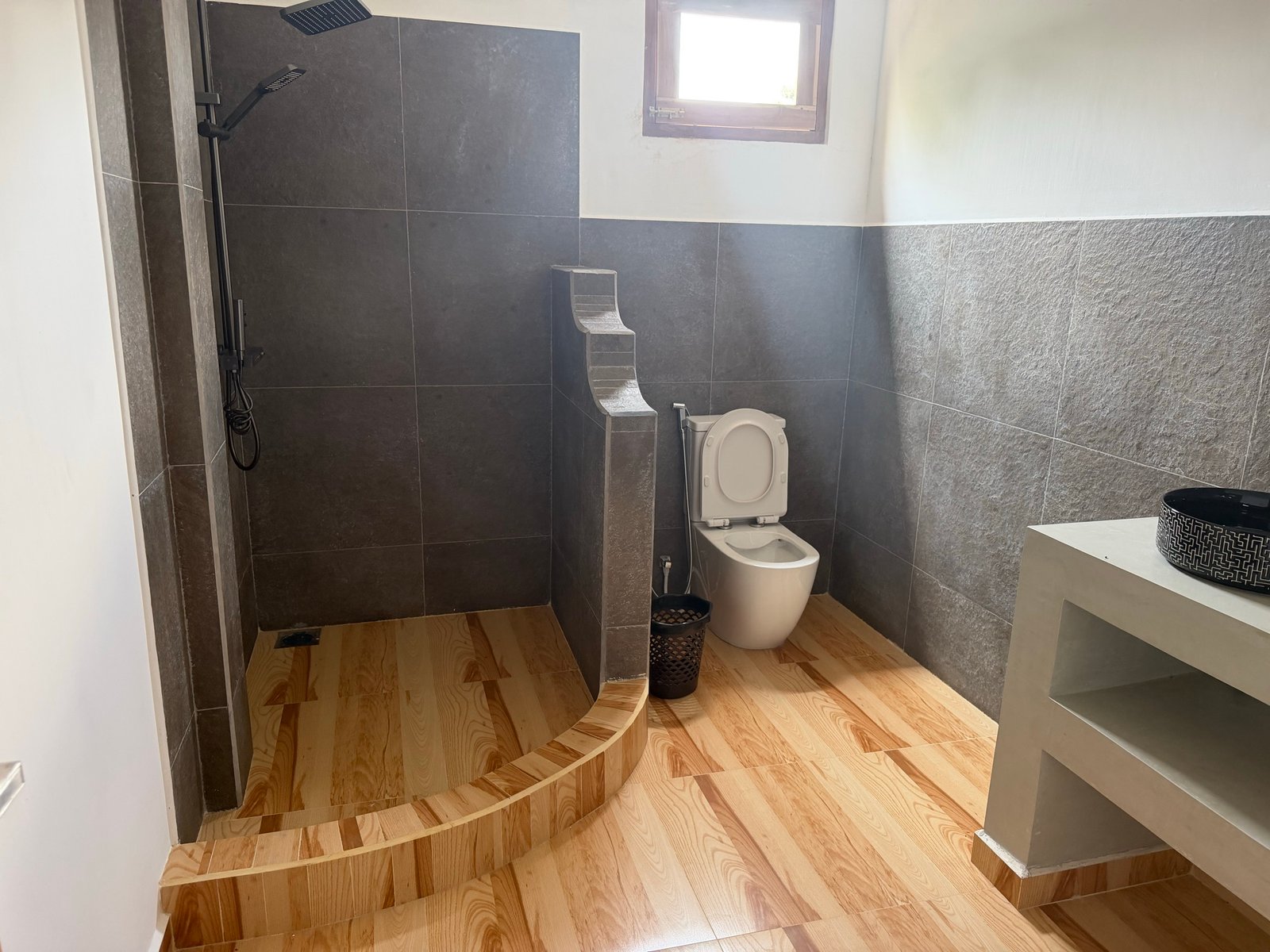 Shared upstairs bathroom — shower and toilet; accessible to all villa guests.